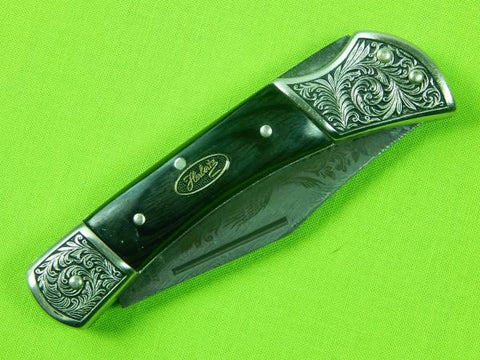 https://www.blackswanantique.com/cdn/shop/products/Vintage_Herbertz_Damascus_Eagle_Engraved_Blade_Lockback_Folding_Pocket_Knife_0_7_480x480.jpg?v=1614200995